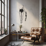 Metal Wall Decor With A Nude Female Figure Walking With A Bra In Her Hand Drawn With Line Art Technique
